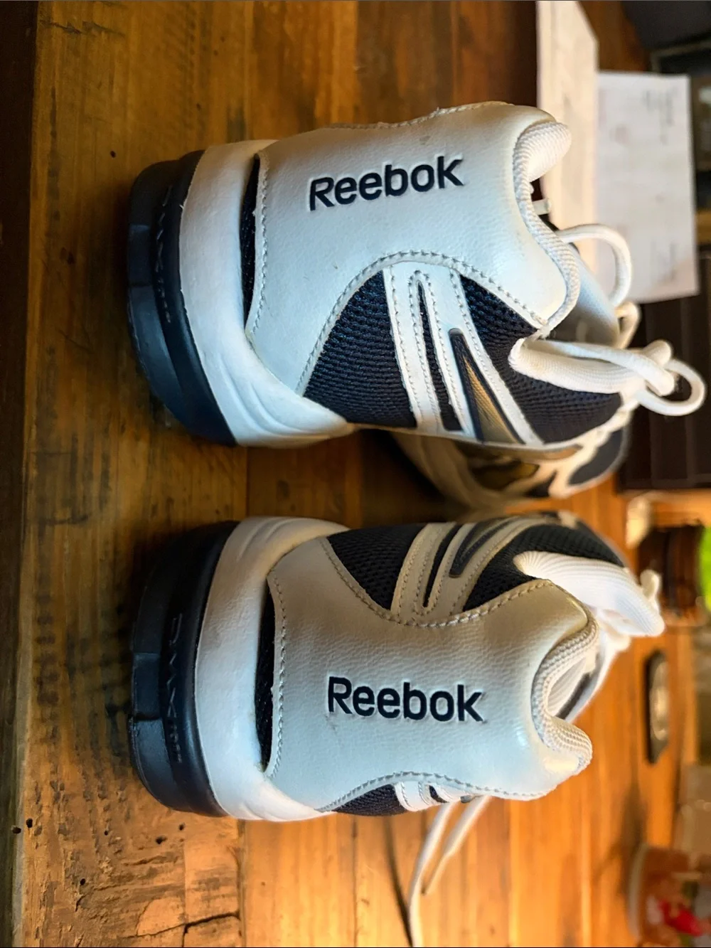 Like New Reebok size 10.5 Men's White and Navy Athletic Sneakers with Gold Accen